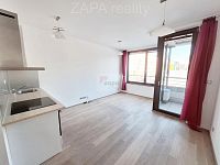 Pronájem 1+kk/B  27,5 m2 + sklep 4m2 + garážové stání novostavba 4.patro  výtah Praha 9 Vysočany - obývací pokoj + balkon 2 logo.jpg