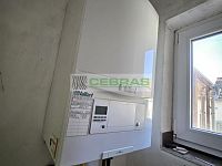 Rodinný dům s velkým potenciálem a navazujícím stavebním pozemkem v srdci Kamenného Újezdu! - Plynový kotel