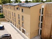 Ihned k nastěhování. Investiční 2+kk u Prahy 6. - Tuchoměřice Budova.jpg