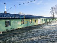 Prodej komerčního objektu 809 m² s pozemkem – Vysoké u Žďáru nad Sázavou - A_photograph_taken_in_the_early_morning_shows_a_ro.jpg