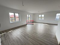 Prodej novostavby RD 4+kk v Podolí I. - obývací pokoj s kuchyňským koutem