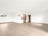 Prodej novostavby RD 4+kk v Podolí I. - obývací pokoj s kuchyňským koutem